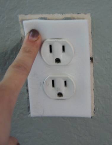 Insulation around outlet (excuse the bad paint job on my nails)