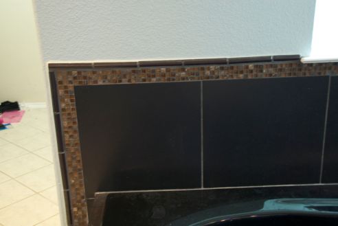 The tile detail around the tub